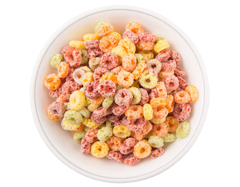 Colorful fruit flavored loops shaped cereal in a white bowl